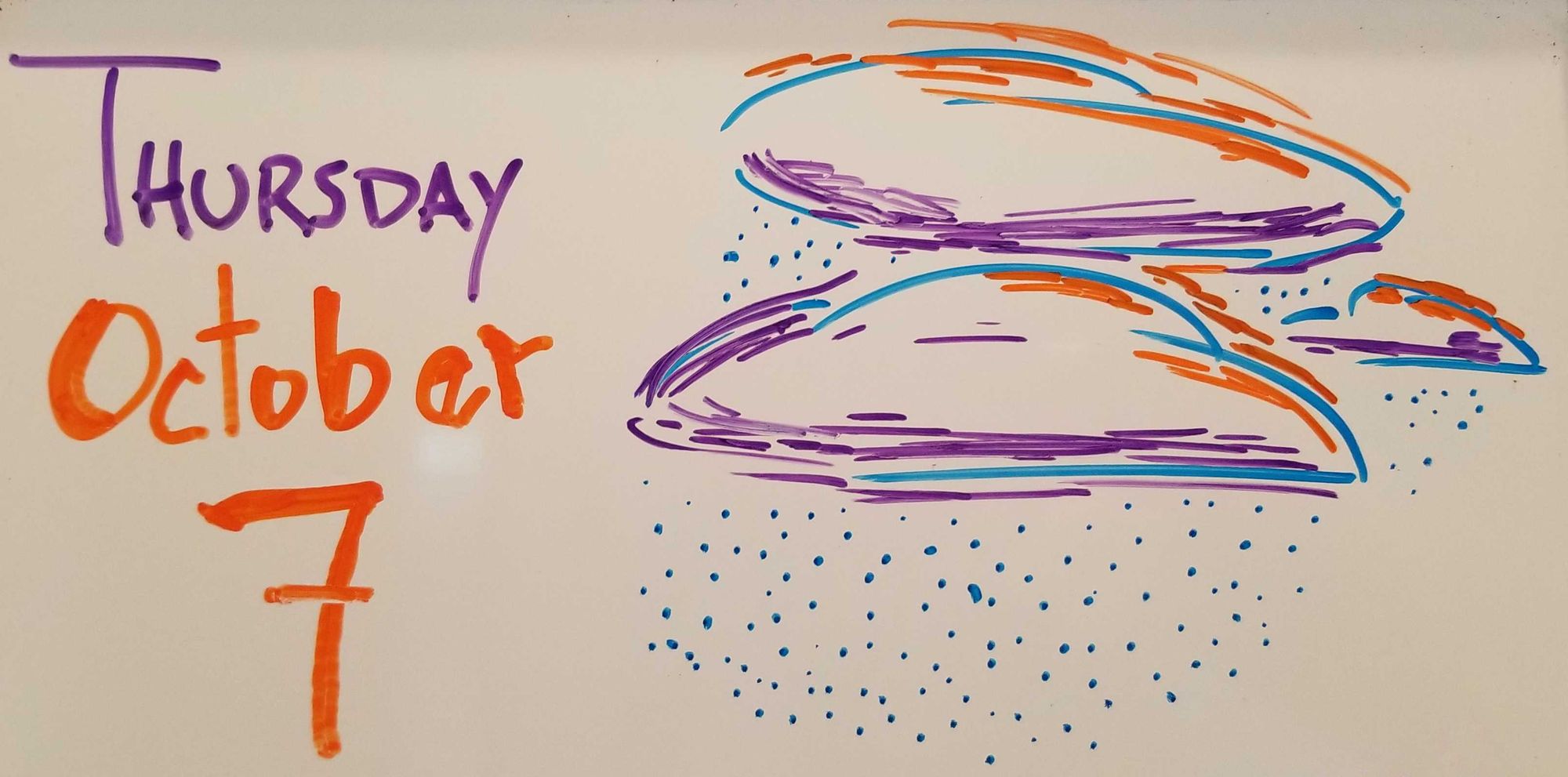 Dry erase marker drawing of clouds and rain in blue, orange, and purple.